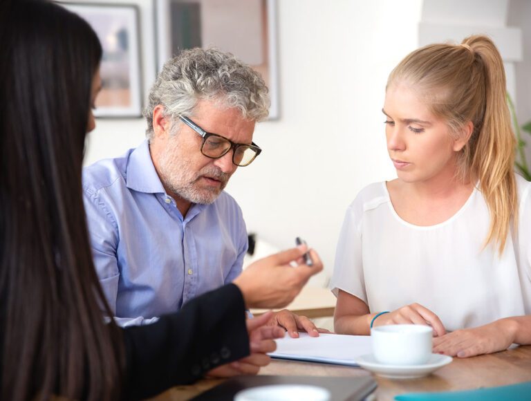 focused mature man reading document